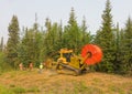 Workmen laying fibre optic cable in the northwest territories