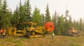 Workmen laying fibre optic cable in the northwest territories