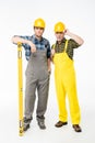 Workmen with level tool Royalty Free Stock Photo