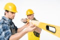 Workmen with level tool Royalty Free Stock Photo