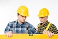 Workmen with level tool Royalty Free Stock Photo