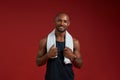 After workout. Cheerful afro american man with towel on his shoulders looking at camera with smile while standing Royalty Free Stock Photo