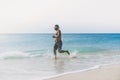 Workout exercise concept.Healthy Handsome Active Man With Fit Muscular Body running on the beach. Sporty Athletic Male Royalty Free Stock Photo