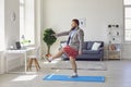 Workout fitness exercise sport at home. Funny fat man doing exercises sport in the room online at home.