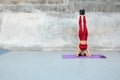 Workout. Fitness Girl Standing On Head. Sexy Woman With Raising Legs Exercises On Yoga Mat At Outdoor Stadium. Royalty Free Stock Photo