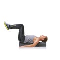 Workout, foam roller and man in pilates back exercise, legs stretching or stability for sports rehabilitation, wellness