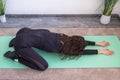 Workout at home.Athletic woman in sportswear doing stretching exercises at home in the living room. Royalty Free Stock Photo