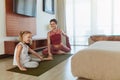 Workout At Home. Mother And Child Stretching Together In Living Room. Little Girl And Young Woman Exercising On Yoga Mat. Royalty Free Stock Photo