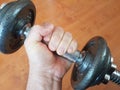 Workout human hand strong lifting arm heavy weight closeup equipment Royalty Free Stock Photo