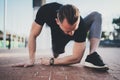 Workout lifestyle concept.Young man doing stretch exercises muscles before training.Muscular athlete exercising outside Royalty Free Stock Photo