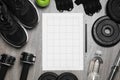 Workout plan, pencil and sports equipment on wooden table, flat lay. Personal training Royalty Free Stock Photo