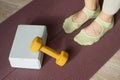 Workout and stretching accessories equipment in pilates studio. Yoga foam block, dumbbell and mat for fitness exercise Royalty Free Stock Photo