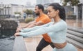 Workout, stretching and couple of friends training with focus before running in the rain. Urban, runner athlete and Royalty Free Stock Photo