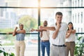 Workout, stretching and a group of business people in the office to exercise for health or mobility together. Fitness Royalty Free Stock Photo