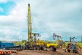 Workover rig working on a previously drilled well trying to restore production through repair. Service of oil-extracting