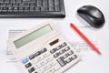 Workplace of accountant closeup: invoice, keyboard, calculator, mouse, and pen Royalty Free Stock Photo