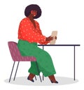 Workplace of african woman with digital tablet in hands sitting at table, female and technology