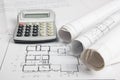 Workplace of architect - Architectural project, blueprints, rolls and calculator on plans. Engineering tools view from Royalty Free Stock Photo