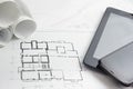 Workplace of architect - Architectural project, blueprints, rolls and tablet, pen, divider compass on plans. Engineering Royalty Free Stock Photo