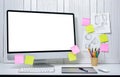 workplace background for designers with Blank white screen modern desktop computer. Royalty Free Stock Photo