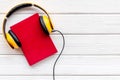 Workplace with books and headphones on white wooden background flatlay mockup