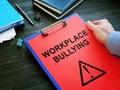 Workplace Bullying complain papers in the office. Royalty Free Stock Photo