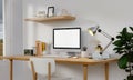 Workplace, computer with blank empty white screen display monitor on desk. Mock up, copy space. Home office concept Royalty Free Stock Photo