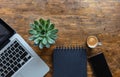 Workplace. Computer laptop and mobile phone on a wood office desk, top view Royalty Free Stock Photo