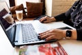 Workplace for a computer.Woman working on laptop on hand of apple watch Royalty Free Stock Photo