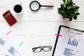 Workplace economist on white office table with space for text