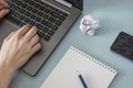 Workplace. Female hands with a notebook and pencil laptop smartphone headphones Royalty Free Stock Photo