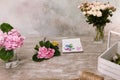 Workplace with flowers, bouquet and sketch Royalty Free Stock Photo