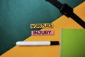 Workplace Injury text on top view color table background