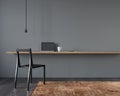 Workplace interior with black chair and a wooden table