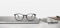 Workplace - laptop computer, eyeglasses at office desk panoramic banner. Royalty Free Stock Photo