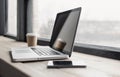 Workplace, laptop computer and mobile phone on office desk. Business, technology, place of work concept