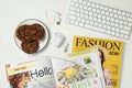 Workplace with modern magazines on white wooden table, flat lay Royalty Free Stock Photo