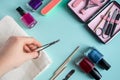 Workplace in a nail salon. A set of tools for hand care on blue background. Place for text. Royalty Free Stock Photo