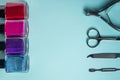 Workplace in a nail salon. A set of tools for hand care on blue background. Place for text. Royalty Free Stock Photo