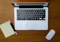 Workplace with notebook, office supplies and wooden desk Royalty Free Stock Photo