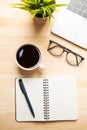 Workplace of office desk wooden table with laptop and eyeglasses and equipment other office supplies Royalty Free Stock Photo