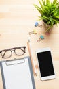 Workplace of office desk wooden table with laptop and eyeglasses and equipment other office supplies Royalty Free Stock Photo