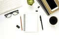 Workplace in the office with a white desk. Top view from above of laptop with notebook and pen. Space for modern creative work of Royalty Free Stock Photo