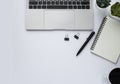 Workplace in office with white desk. Top view from above of laptop with notepad and coffee. Space for modern creative work of desi Royalty Free Stock Photo