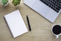 Workplace in office with wood table. Top view from above of laptop with notebook and coffee. Space for modern creative work of des Royalty Free Stock Photo