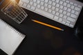 Workplace in office with wooden desk. Top view from above of equipment placed and coffee. Space for modern creative work of Royalty Free Stock Photo