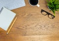 Workplace office with wooden desk. Top view from above of keyboard with notepad and coffee cup. Space for modern creative work of Royalty Free Stock Photo