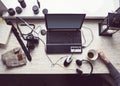 Workplace with open laptop with black screen on modern wooden desk Royalty Free Stock Photo