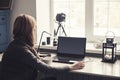 Workplace with open laptop with black screen on modern wooden desk Royalty Free Stock Photo