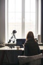 Workplace with open laptop with black screen on modern wooden desk Royalty Free Stock Photo